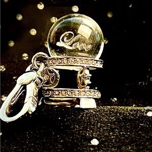 Rare original juicy couture Crystal ball charm with the word love glowing inside